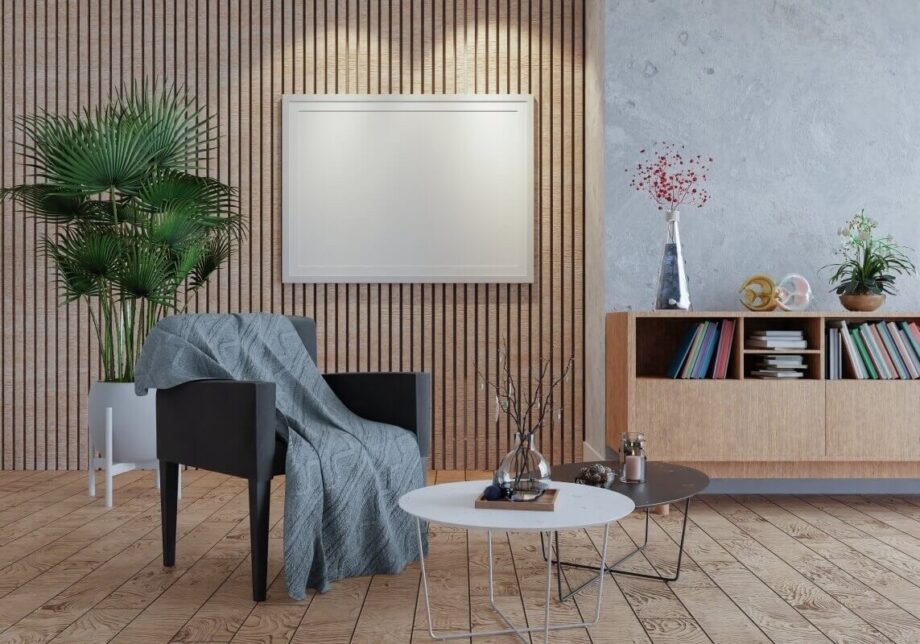 Nowoczesne wnętrze salonu z eleganckim fotelem, a na ścianie zainstalowane promienniki podczerwieni.
